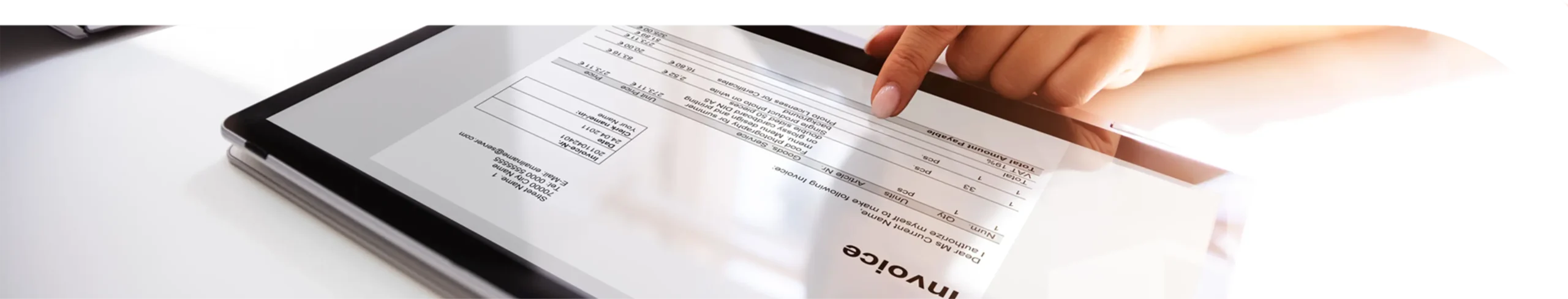 A tablet with an image of an invoice on it