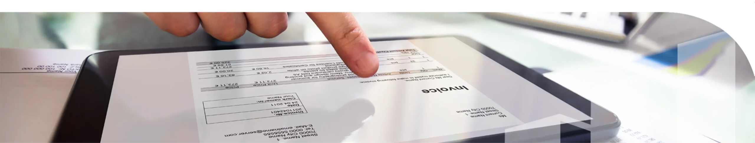 A picture of a man pointing at an invoice