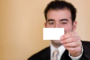 man holding business card