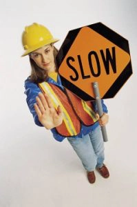 worker with a slow sign